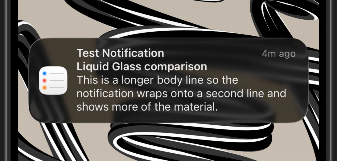 A notification in iOS 26's dark mode using the tinted version of Liquid Glass.